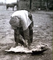 Woman Scraping a hide.