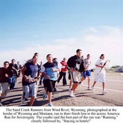 The Sand Creek Runners from Wind River, Wyoming, photographed at the border of Wyoming and Montana, run to their finish line in the across America Run for Sovereignty. The youths said the best part of the run was "Running," closely followed by, "Staying in hotels!" Photo Brenda Norrell 