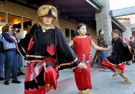 Canoe Family dancers (from left) Roselle Fryberg, Chambray Burleson and Brandi Moore perform a traditional dance Tuesday during the blessing of the Quil Ceda Neighborhood Center