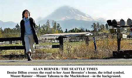 Denise Dillon crosses the road to her Aunt Berenice’s home, the tribal symbol, Mount Rainier — Mount Tahoma to the Muckleshoot — in the background. 
