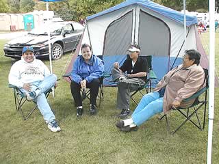 Native American Family Relaxing while Camping at a Pow Wow