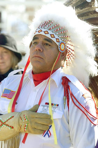 Bruce Running Crane, a member of the Blackfeet Nation, from Browning, Mont., holds his hand over his heart during the Pledge of Allegiance, at ceremonies commemorating the Lewis and Clark expedition in Charlottesville, Va., Saturday, Jan. 18, 2003. The event launched the nation’s three-year commemoration of the expedition across America in 1803-1806 and giving a send- off to the Corps of Discovery II, a traveling interagency exhibition.