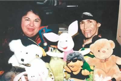 Posing with some of their stuffed animals, which are used as props, are Nancy Richardson-Steele (left) and L. Frank Manriquez of the group Advocates for Indigenous California Language Survival, a program that makes the teaching and learning of language more active.