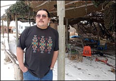 Wilmer Mesteth stands in an arbor where he holds night dances at his home west of Pine Ridge. Mesteth is an arts, language and culture instructor at Oglala Lakota College and a Lakota spiritual leader.