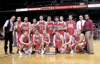 Pioneer Photo by Molly Miron The Red Lake boys basketball team poses for pictures with their Class A 4th-place trophy following their 58-41 loss to Hancock Saturday at Williams Arena in Minneapolis.