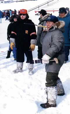 Celestine Erkidjuk takes part in a harpoon-throwing contest held during one of Iqaluit’s Toonik Tyme celebrations in the early 1990s. 