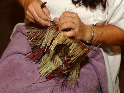Scarlett Darden weaving river-cane