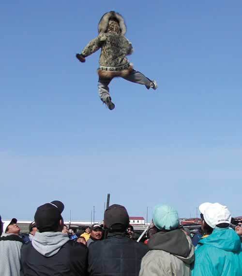 FLYING HIGH—Michael Tuzroyuluk of Point Hope is catapulted up in the air at the whaling feasts blanket toss ceremony. Read more about the meaning of the blanket toss and why it is important to whalers and young mothers of sons in next week's paper. 