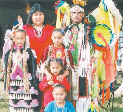 Fancy Dancer Rainbow Azure and his wife Varinia. Their ten-year marriage has produced four little girls that have been raised on the pow wow trail.