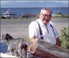 Makah tribal elder John Hottowe and his dog, Henry, in front of their home on Neah Bay. "He gave of his heart," recalls his daughter, Jean Vitalis. Phil H. Webber / P-I 1995
