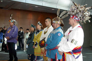 Charlie Patton, along with the Thunderhawk Dancers, open the UN meeting on December 8, 2003, by inviting delegates to clear their eyes, ears and throats and open their minds for the negotiations. The meeting drafted a document that offers some protection to sacred sites of Indigenous Peoples and give it the title the Akwé:kon Guidelines.