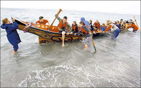 Three years after starting the project, students of Alternative School No. 1 near Northgate and volunteers took their first paddle in the "Ocean Spirit" canoe they carved from a 750-year-old red cedar log. The 40-foot canoe, which will become a gift to the Haida Nation in Alaska, will be on display at the Seattle School Board Building until mid-March. (February 25, 2004) Photo Credit: Meryl Schenker/Seattle Post-Intelligencer