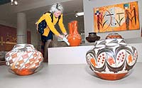 Nancy Blomberg, curator of the Denver Art Museum's Native Arts department, arranges one of the 320 contemporary pieces recently donated to the museum. - Post / John Prieto