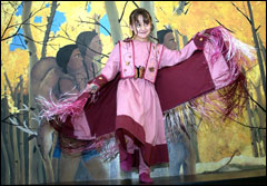 Jazmyne Lee Brave dances in an authentic native American dress she and academic support teacher, Tammara Rosenleaf, made as part of Jazmyne's cultural studies at Wakina Sky. - Eliza Wiley IR Staff Photographer