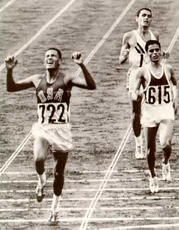 Billy Mills wins 10000 meter race at the Tokyo Olympics