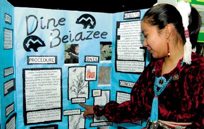 Thoreau Middle School seventh grader Kumiko Manuelito explains that native plants can cure some minor illnesses and save a trip to the hospital. Her entry is "Dine Beiazee" -Navajo medicine. (Times photo - Paul Natonabah)