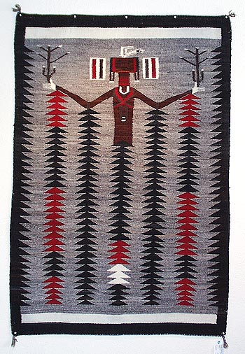 Very unusual Navajo Yei pictorial rug, with the Yei figure changing to rain midway down, c. 1935. 3'6" x 5'2"