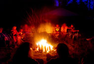 Pilgrim and her extended family and friends tell stories and sing around the campfire the night before the ceremony.