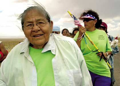 Marjorie Thomas, 73, better known as Grandma Thomas, walks to raise money for a youth center Monday during the 11th Annual Grandma Thomas Walk-A-Thon south of Chinle. Thomas has raised about $85,000 with no help from Navajo Nation leaders. (Special to the Times - Donovan Quintero)